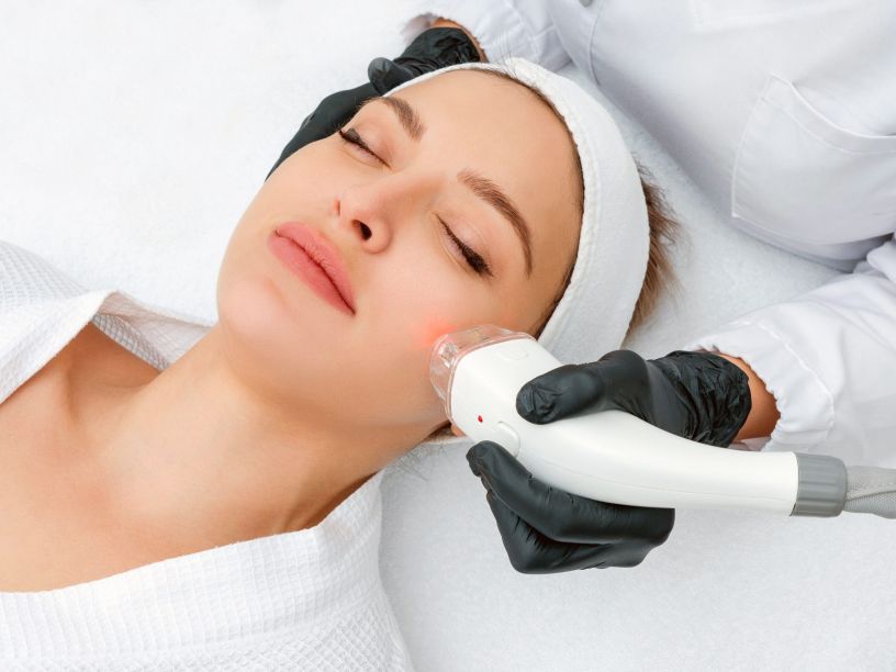 Young woman receiving laser treatment