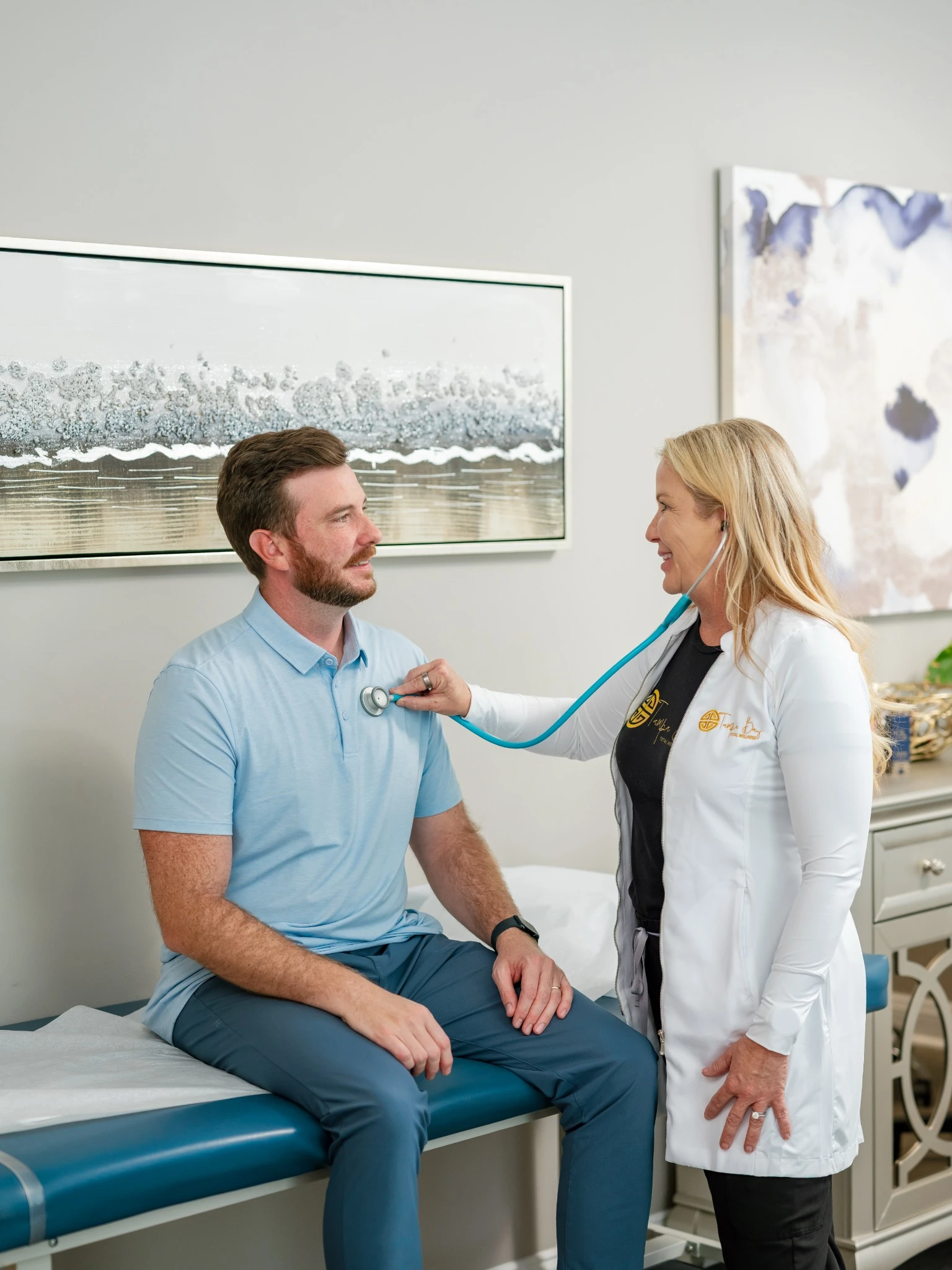 Longevity concierge health consultation at Tampa Bay Total Wellness with provider performing wellness evaluation and patient care