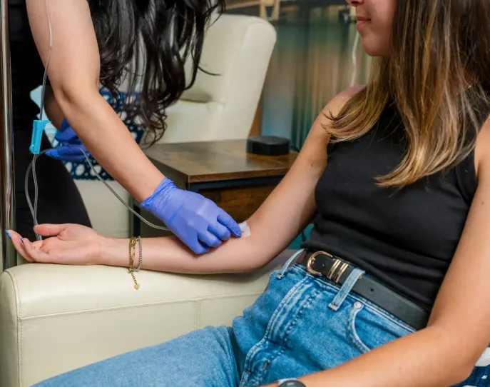 Nurse doing lab work on patient