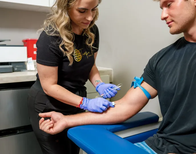 Nurse doing blood work on patient
