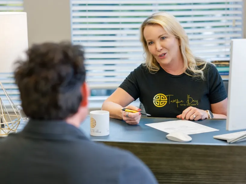 Provider discussing the TRT Membership Program with a patient during a hormone replacement consultation at Tampa Bay Total Wellness